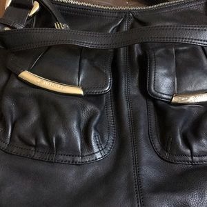 Black purse Makowsky and maroon Makowsky